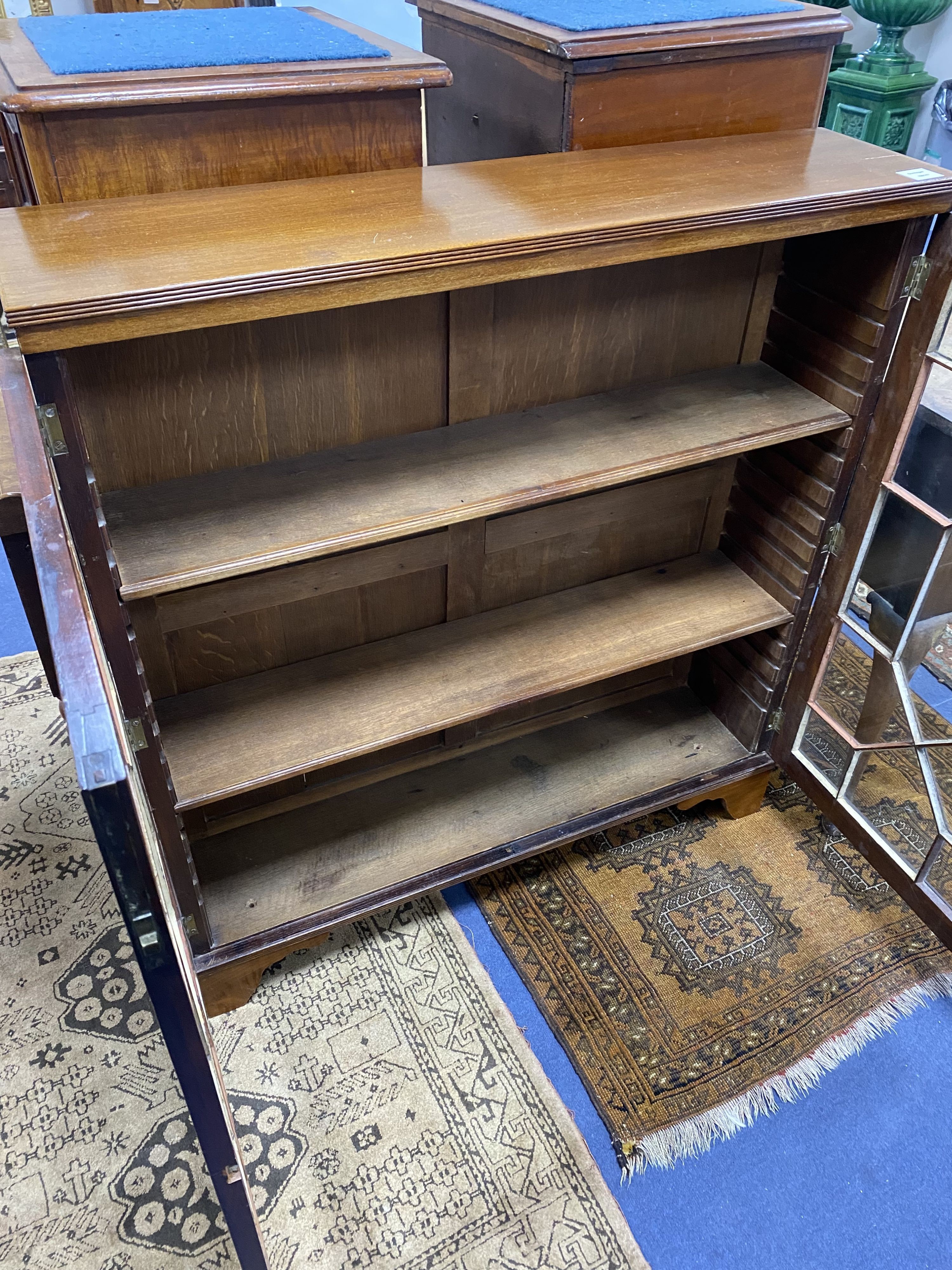 A George III style mahogany two door glazed cabinet, width 86cm, height 113cm